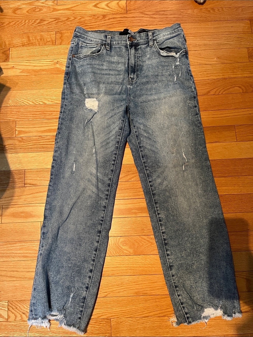 Woman’s Distressed Blue Denim Jeans